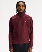 Fred Perry Contrast Tape Track Jacket Oxblood / Champagne Track Jackets J5557-69A On Model Front View | Overkill
