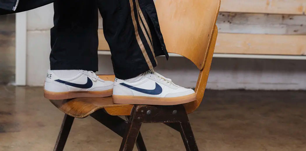 Classic Nike SB Dunk Low '07 shoe with a sleek black and white color scheme, showcasing the signature Nike Killshot detailing.