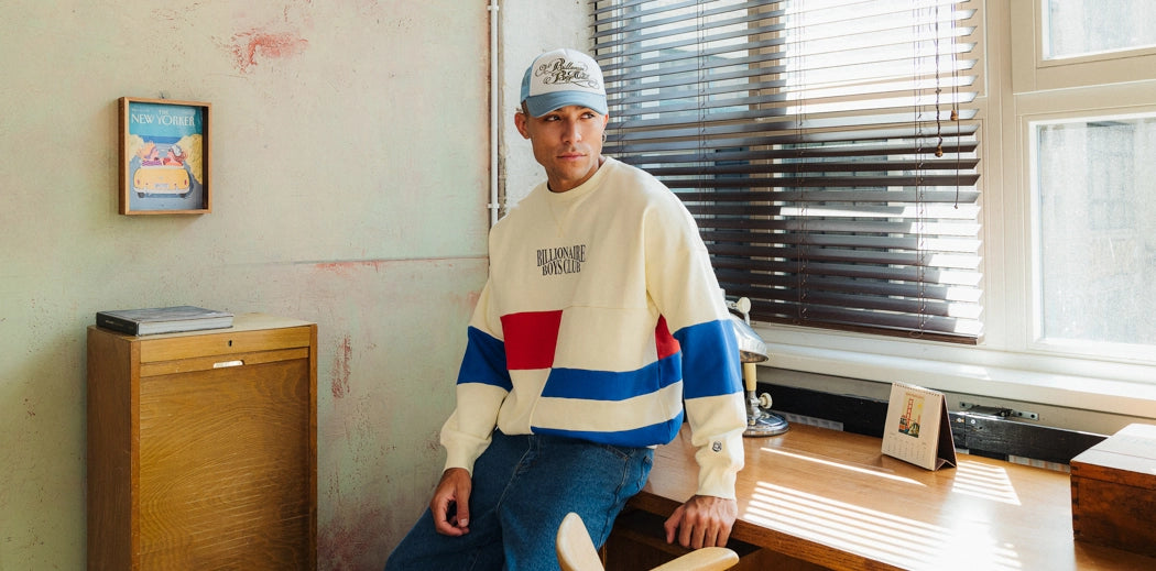 Two people enjoying ice cream, wearing Billionaire Boys Club brand apparel.
