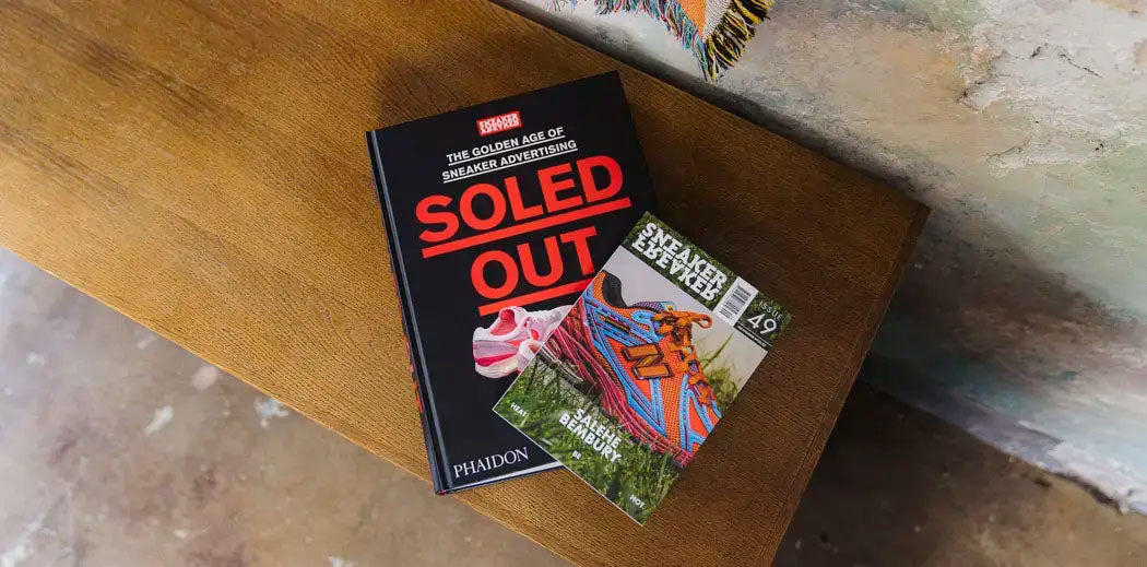 Two books by Sneaker Freaker placed on a bench.