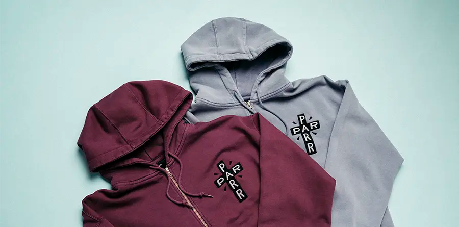 Two hooded sweatshirts from PARRA, one burgundy and one gray, each with a small logo on the chest reading 'PARR'