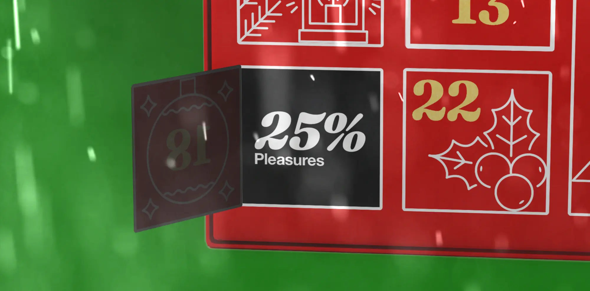 A person in a black streetwear brand PLEASURES t-shirt with a bold yellow and red shield design sits on a concrete stool, facing a textured dark gray wall, on a wooden floor.