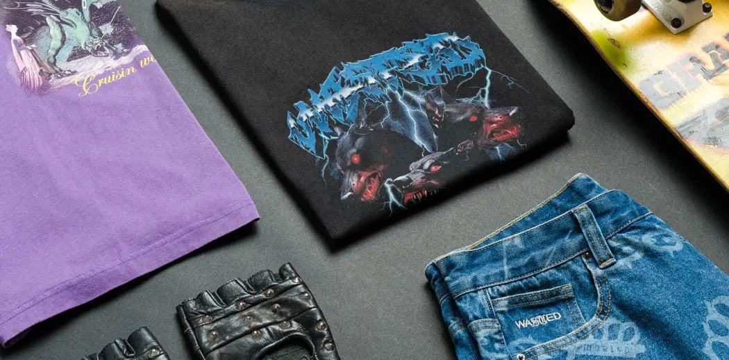 Laydown of different Wasted Paris Streetwear items like T-Shirts, Denim Jeans, Skateboards etc.