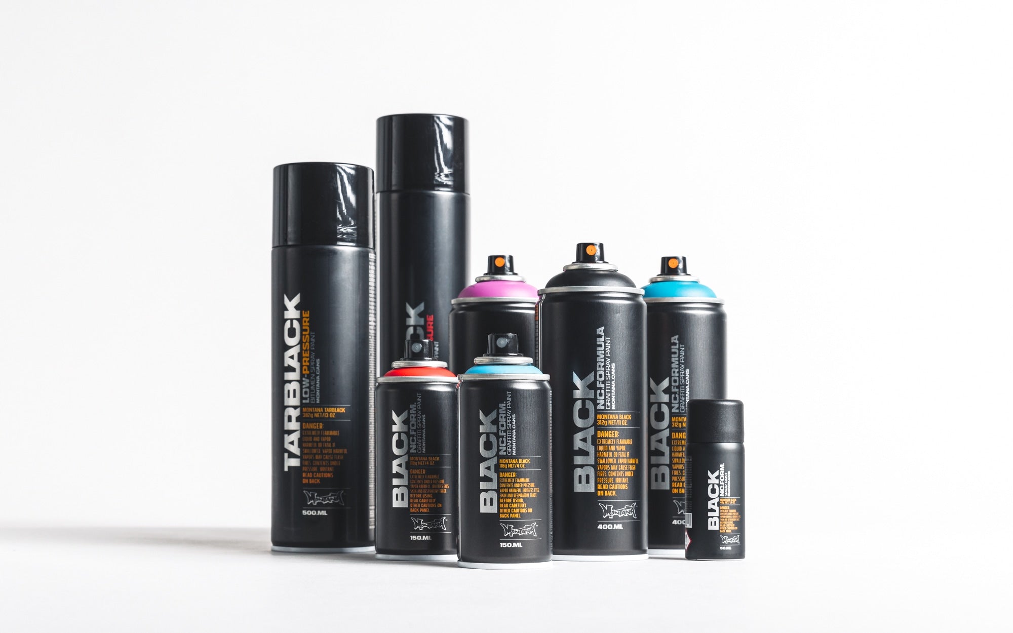 Colorful Montana spray cans lined up in a row.