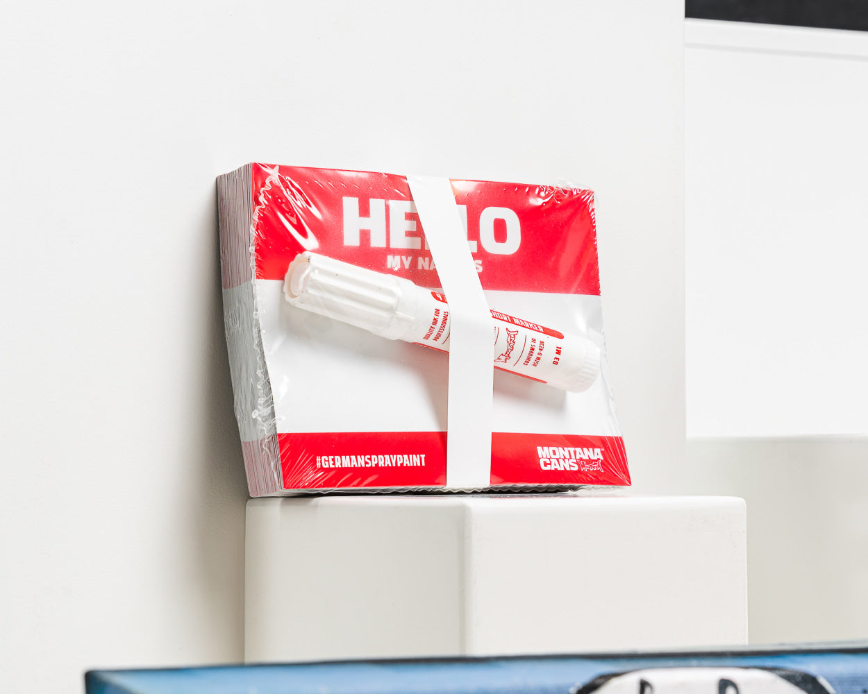 A white box with "hello" stickers written on it, a simple and friendly greeting.