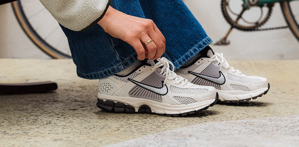 Sleek Nike Zoom Vomero sneakers designed for runners with plush cushioning and a modern look.