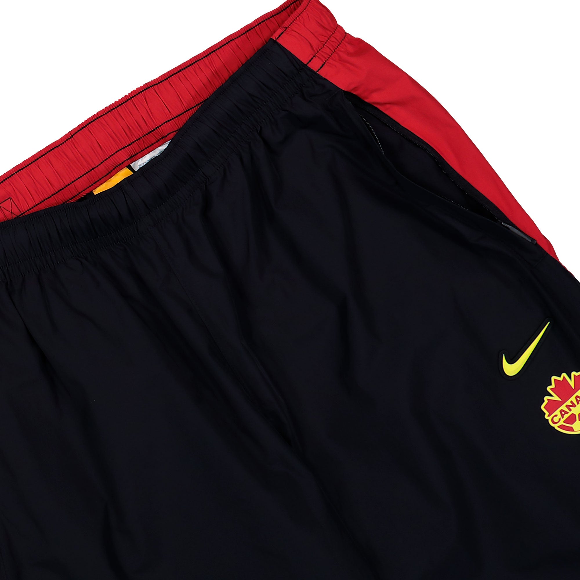 NOCTA x Nike Canada Soccer Track Pants Black / Gym Red / Sonic Yellow / Sonic Yellow Sweat & Track Pants IM3236 010 Detail View 1 | Overkill
