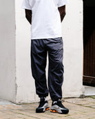 The North Face M TNF RB Wind Pant Obsidian Sweat & Track Pants NF0A8EFV0SA On Model Front View | Overkill