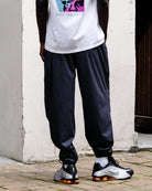 The North Face M TNF RB Wind Pant Obsidian Sweat & Track Pants NF0A8EFV0SA On Model Back View | Overkill