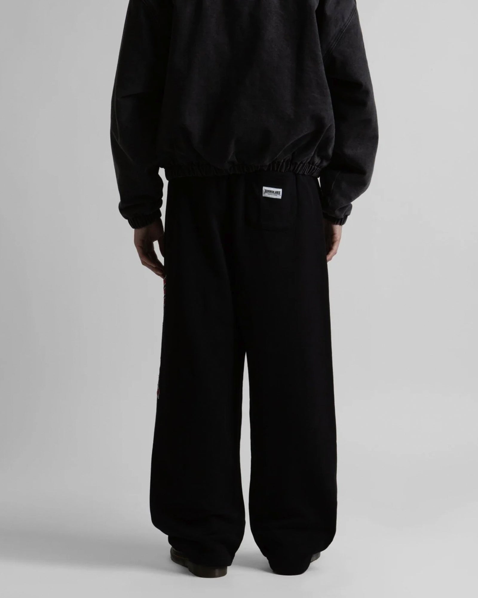 Wasted Paris Pusher Jogging Pant Black Sweat & Track Pants 175543 On Model Back View | Overkill
