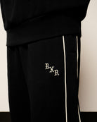 Born x Raised BXR Piped Sweatpants Black Sweat & Track Pants B2004PIPED-BLK On Model Back View | Overkill
