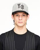 Y-3 Pinstripe Cap Chalk White Caps KR8937 On Model Front View | Overkill
