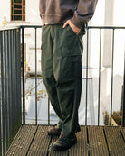 WTAPS Milt9601 / Trousers / Cotton. Ripstop Olive Drab Cargo Pants 252WVDT-PTM01 On Model Front View | Overkill
