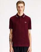 Fred Perry Twin Tipped Fred Perry Shirt Oxblood / Stockport Blue Polo Shirts M3600-08B On Model Front View | Overkill

