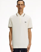 Fred Perry  Twin Tipped Fred Perry Shirt Ecru / Dark Caramel / Black Polo Shirts M3600-79B On Model Front View | Overkill
