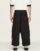 Willy Chavarria x adidas Woven Tracksuit Pant Black    Sweat & Track Pants KU7798 On Model Back View | Overkill
