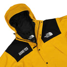 The North Face GTX Mountain Jacket Summit Gold - TNF Black Jackets Close-up | Overkill