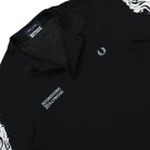 Fred Perry Noongoons X Fred Perry LS Printed Polo Shirt Black Longsleeves Close-up | Overkill