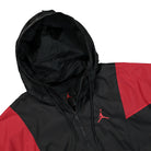 Jordan Air Jordan Essential Woven Jacket Black / Gym Red Track Jackets Close-up | Overkill