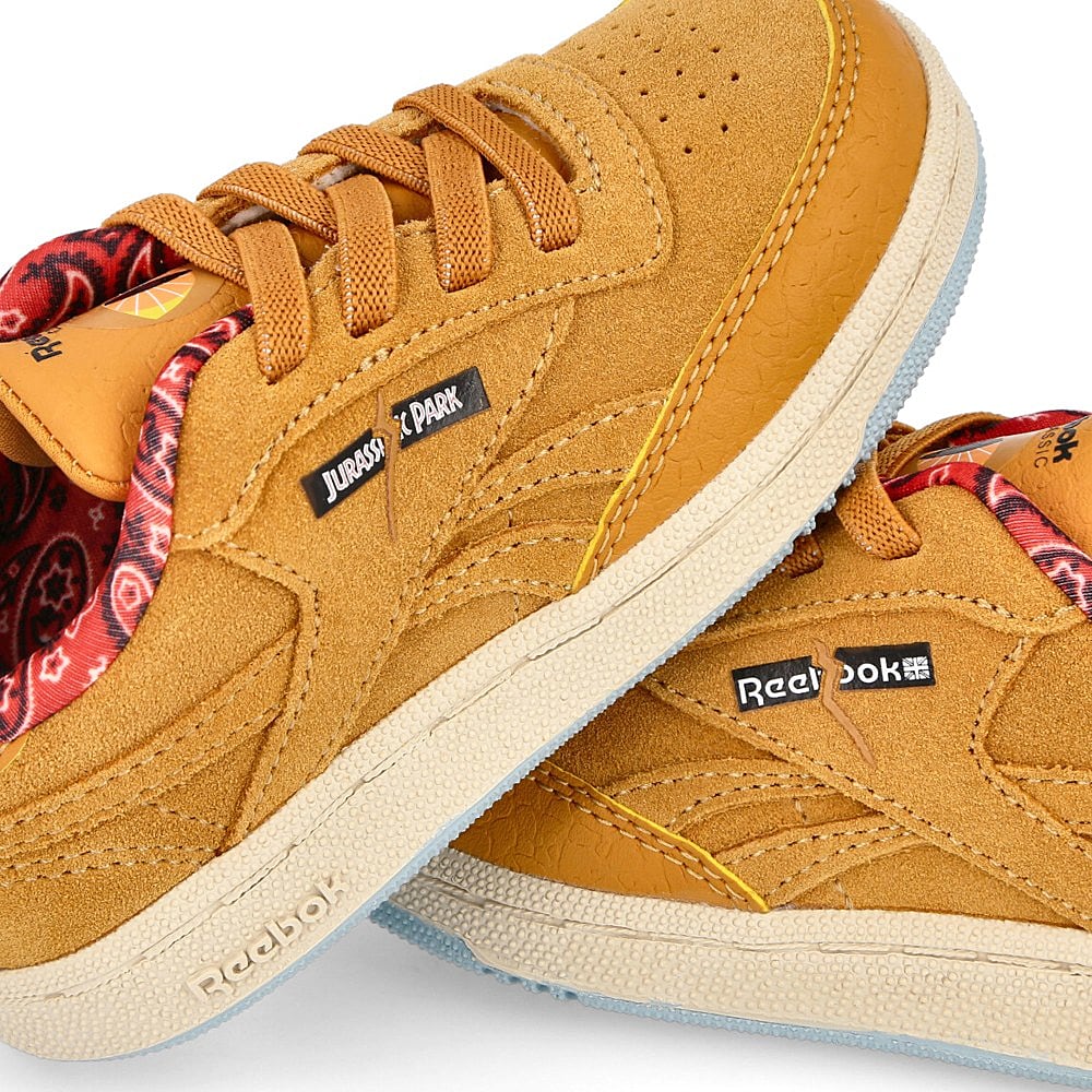Reebok Jurassic Park x Reebok Club C 85 Infants Rich Ochre / Diffused Blue / Stadium Red  Detail view 1 | Overkill
