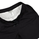 Carhartt WIP Chase Swim Trunks Black / Gold Swimwear Close-up | Overkill