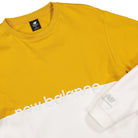 New Balance Athletics Pique Stripe Long Sleeve Varsity Gold / White Longsleeves Close-up | Overkill